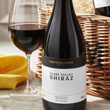 Wicker wine hamper with four assorted bottles, imported from the UK