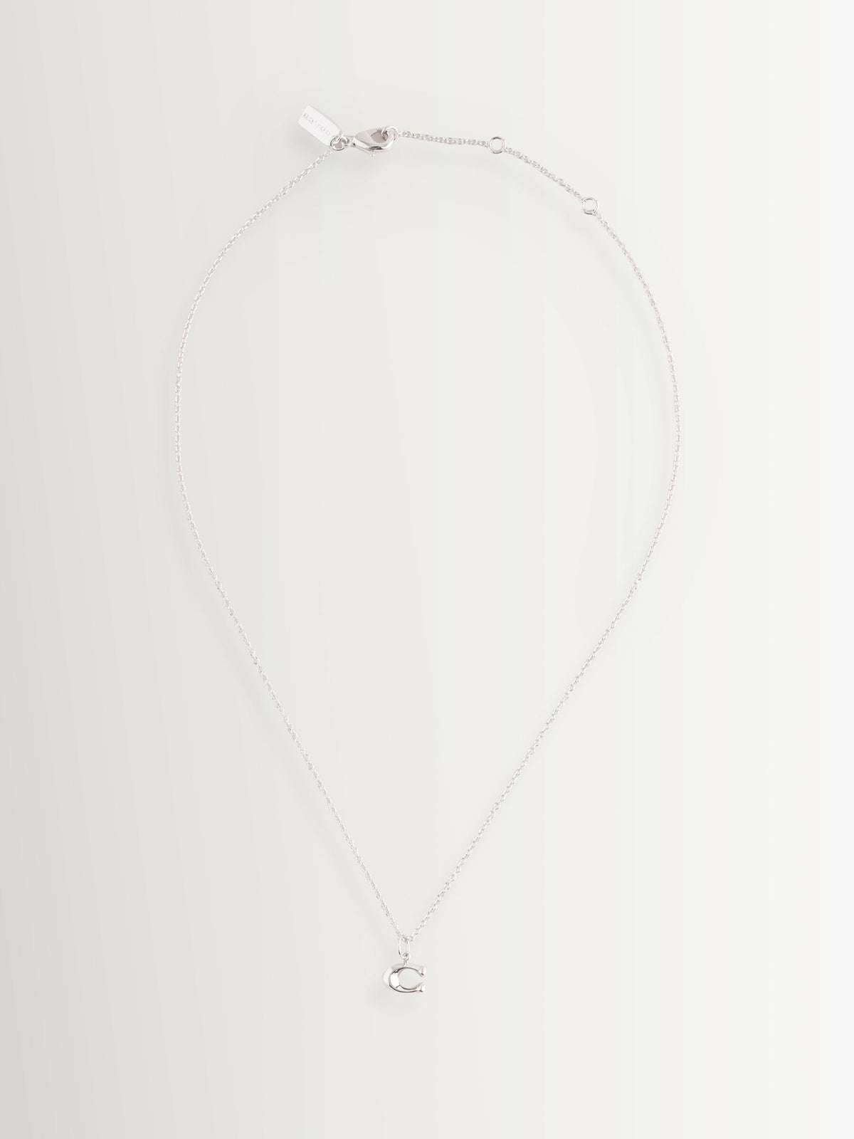 COACH silver tone C starter necklace, imported from the UK