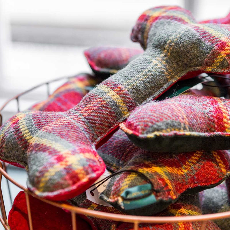 Fortnum's red tartan dog bone cushion, imported from the UK
