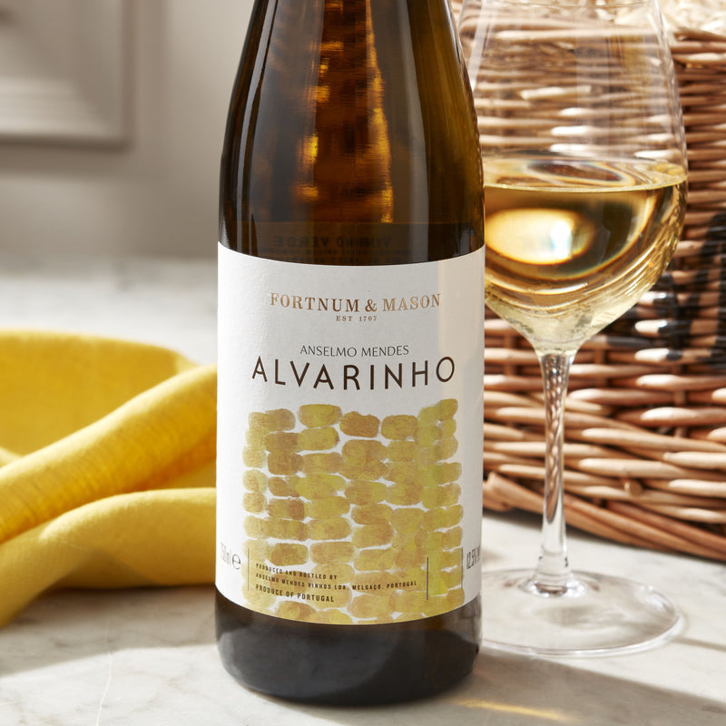 Wicker wine hamper with four assorted bottles, imported from the UK