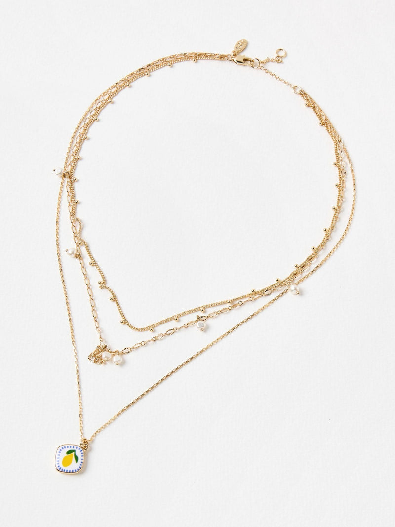 Oliver Bonas faux pearl lemon pendant necklace, imported from the UK