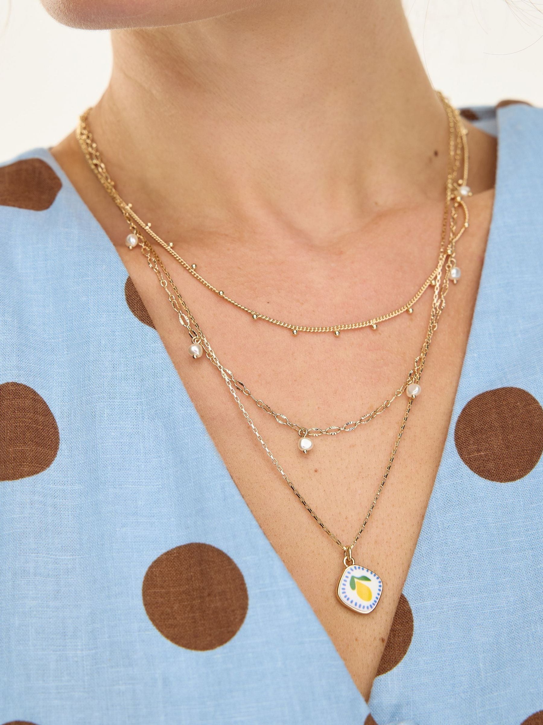 Oliver Bonas faux pearl lemon pendant necklace, imported from the UK