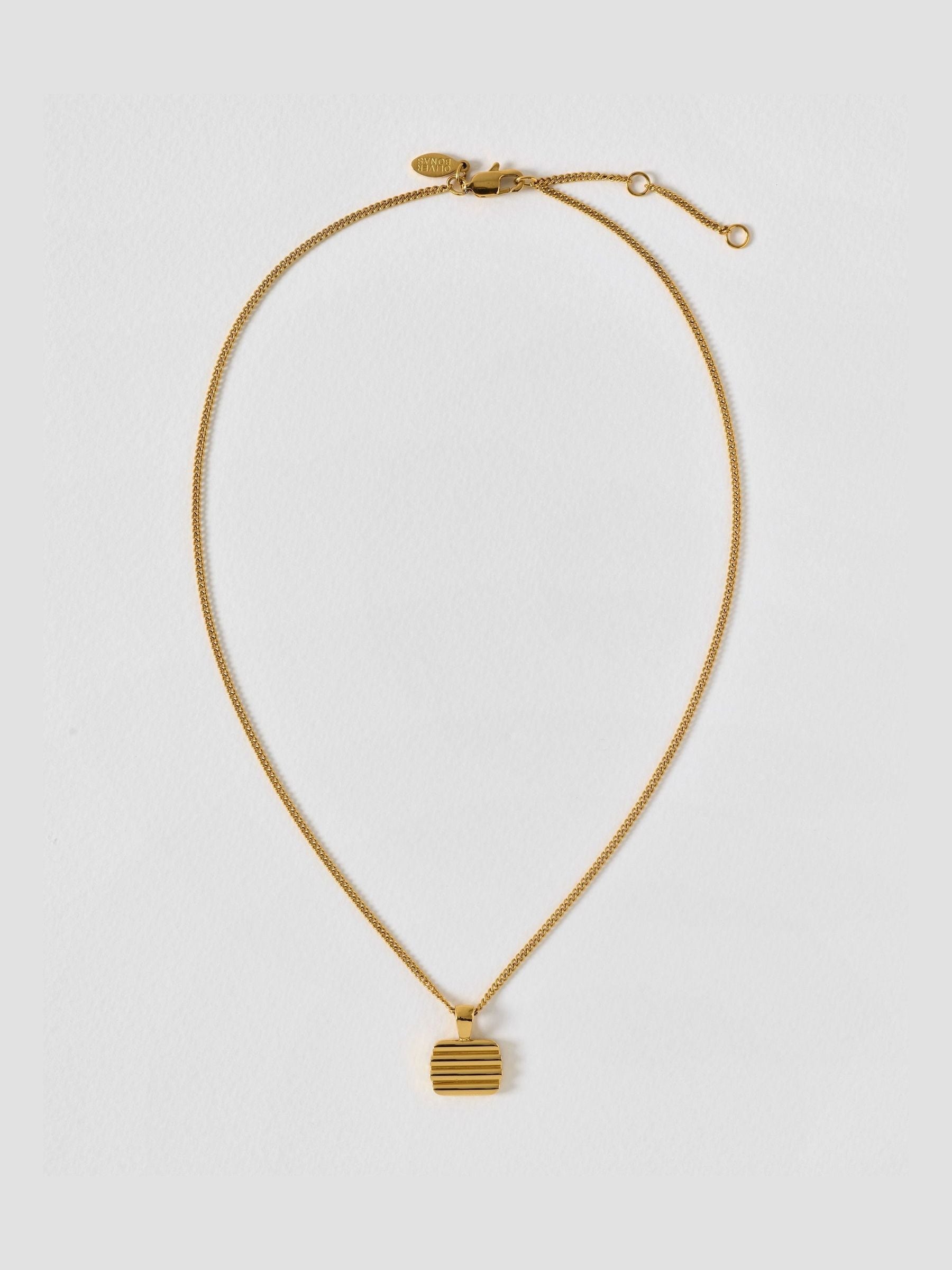 Oliver Bonas gold tone waterproof ridged disc pendant necklace, UK version