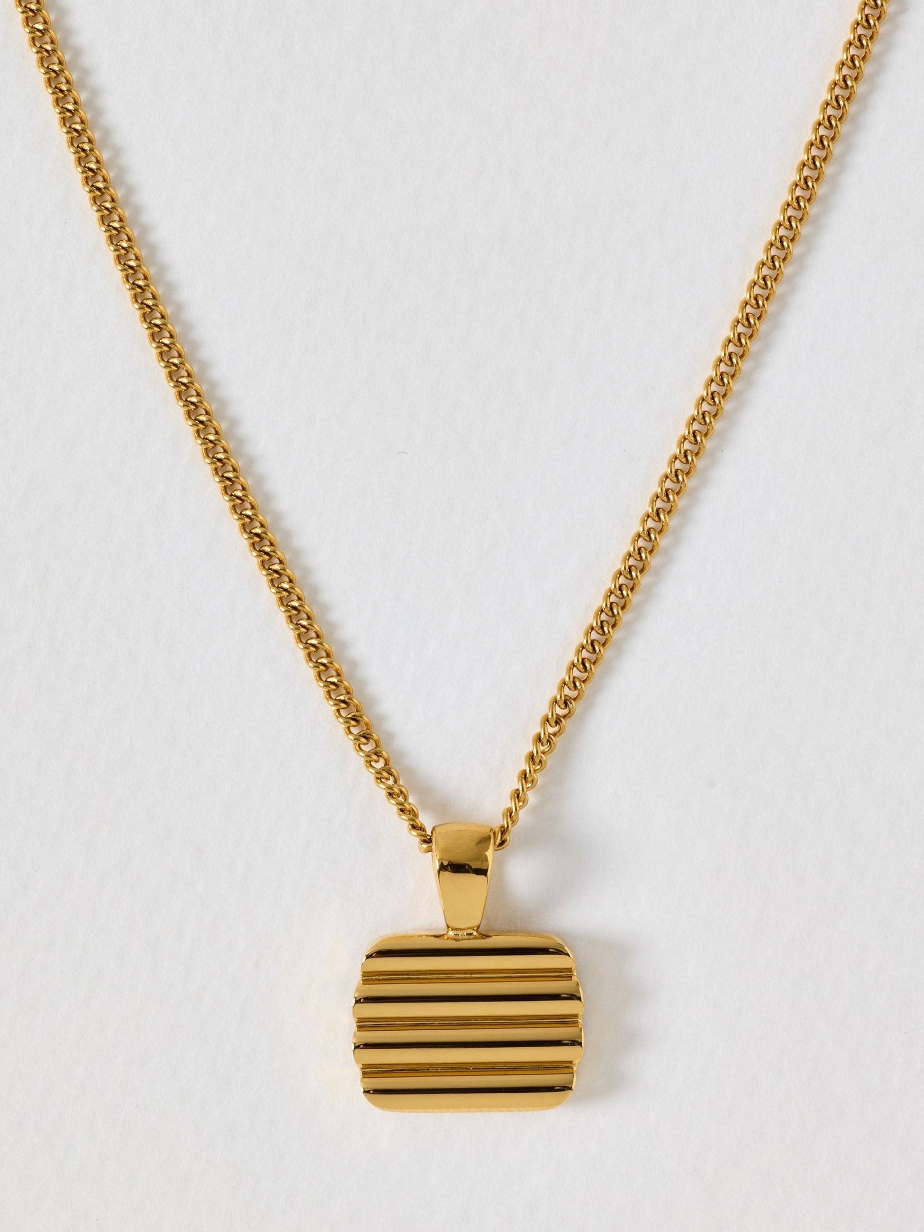 Oliver Bonas gold tone waterproof ridged disc pendant necklace, UK version