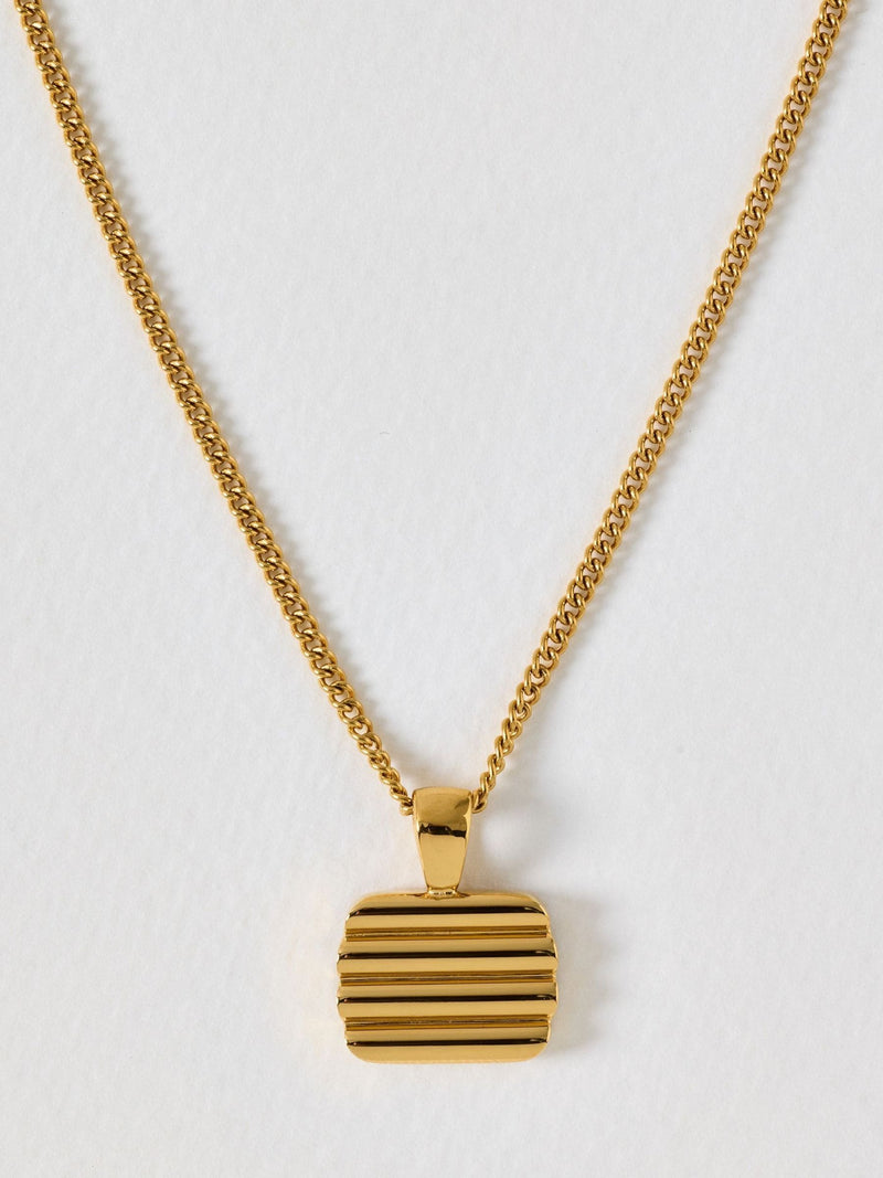 Oliver Bonas gold tone waterproof ridged disc pendant necklace, UK version