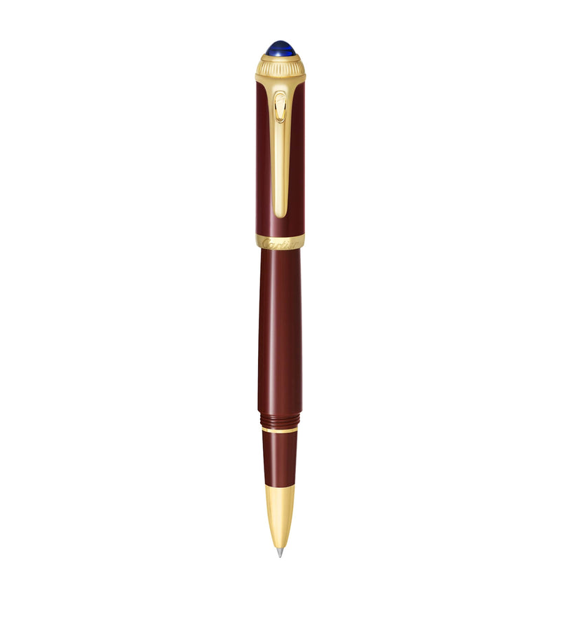 Cartier composite rollerball pen with gold-tone details and blue resin cabochon, 15cm length - British product