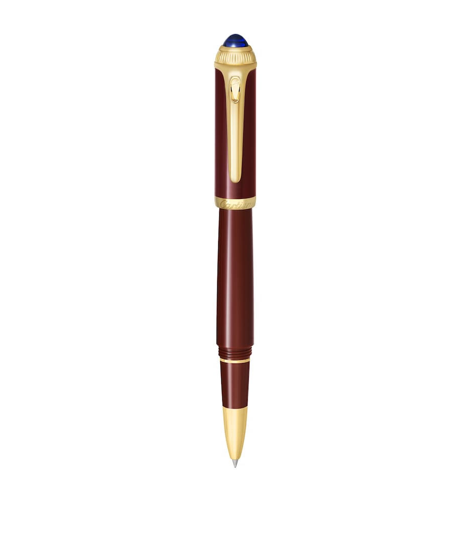 Cartier composite rollerball pen with gold-tone details and blue resin cabochon, 15cm length - British product