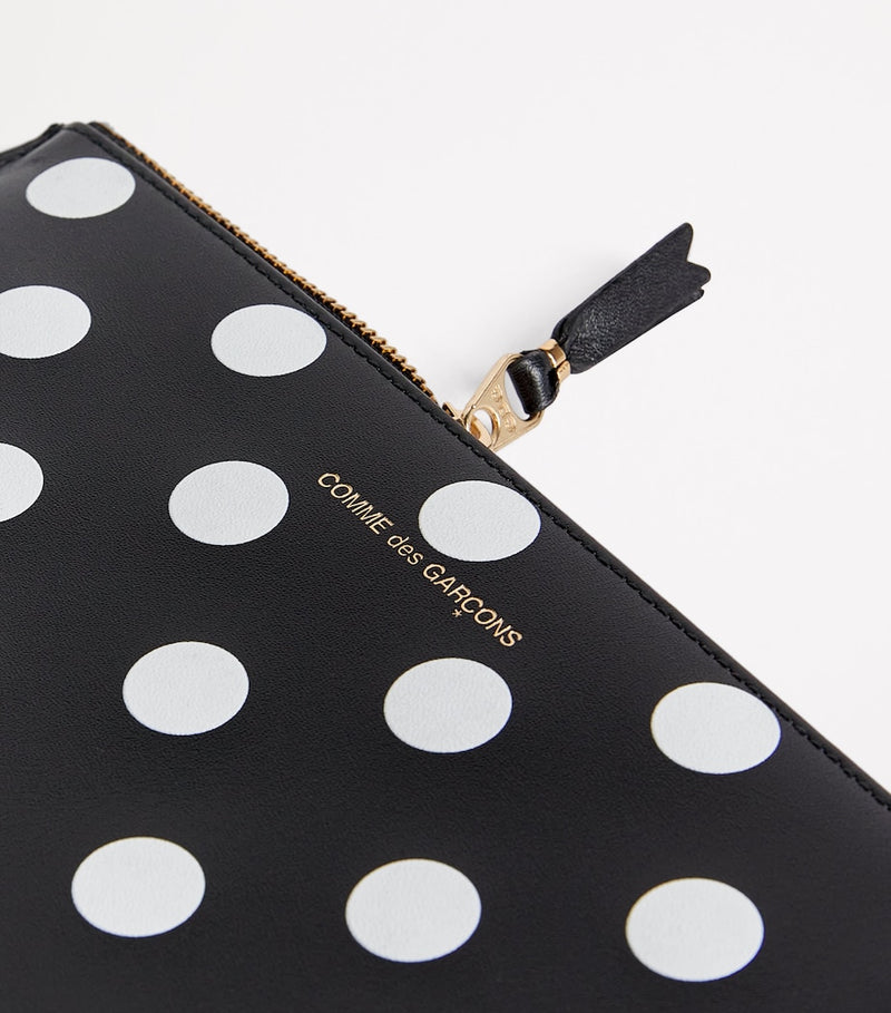 Comme Des Garçons large leather polka-dot zipped pouch, imported from the UK