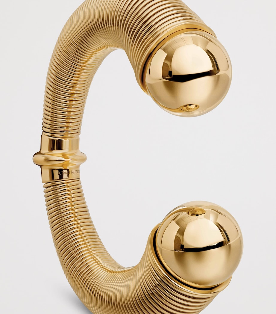 Alaïa spiral cuff gold-tone design with metal beads, UK version