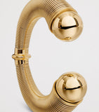 Alaïa spiral cuff gold-tone design with metal beads, UK version