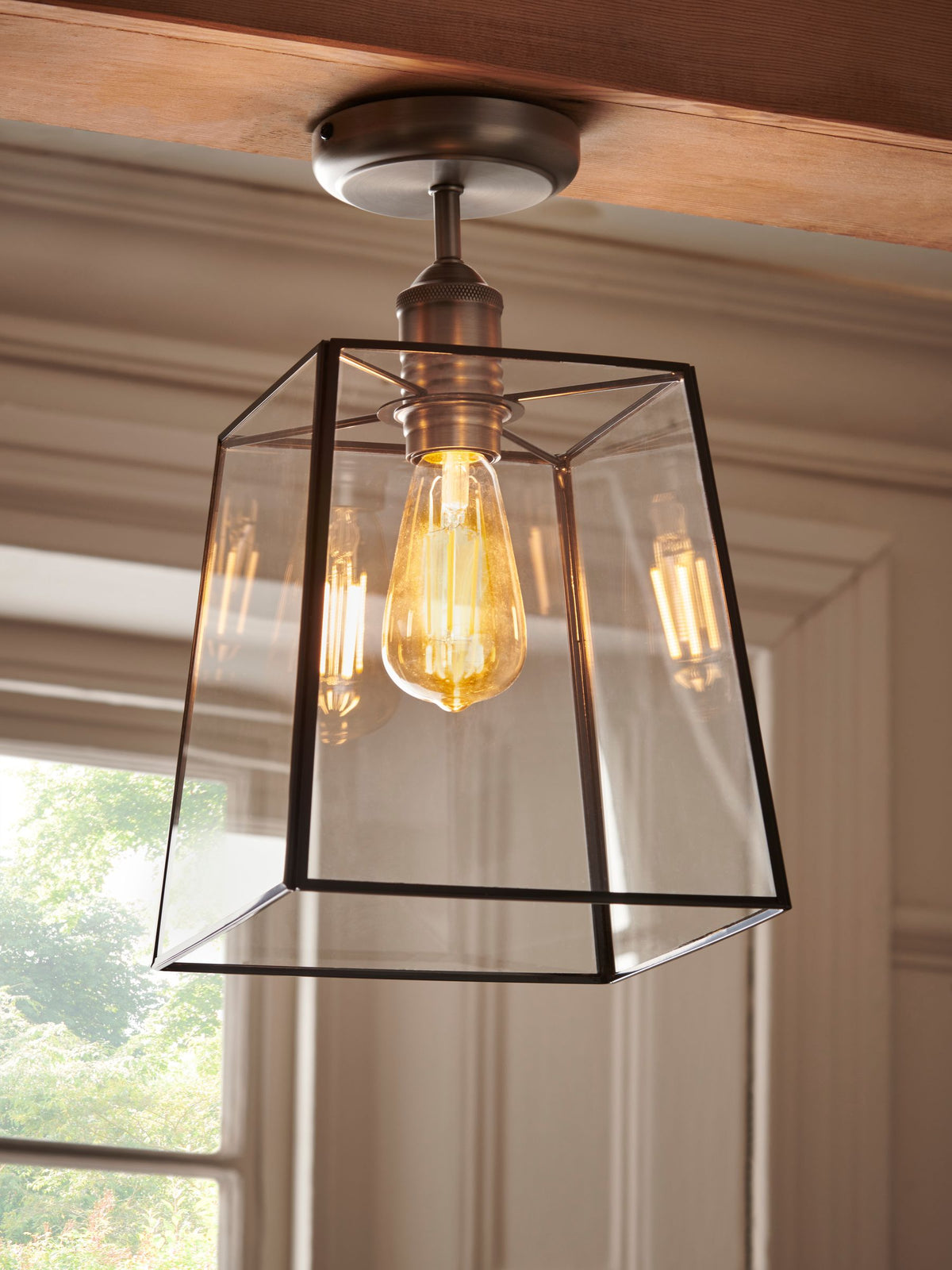 Black Warwick flush ceiling light with glass shade, imported from the UK