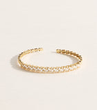 Suzanne Kalan yellow gold and diamond bangle (British brand)