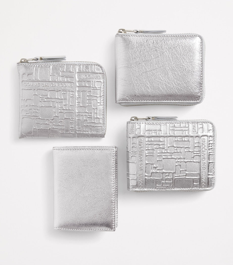 Comme Des Garçons leather folding card holder with silver metallic strip, UK version