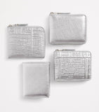 Comme Des Garçons leather folding card holder with silver metallic strip, UK version