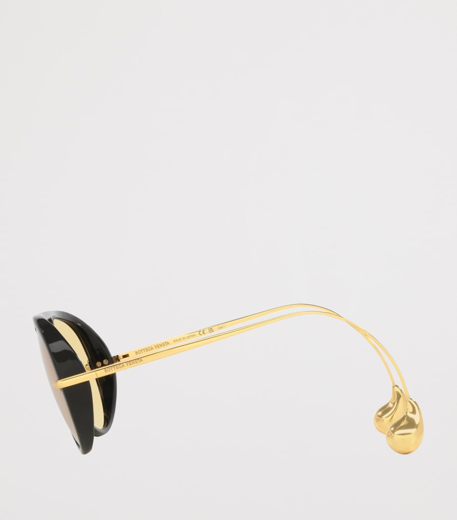 Bottega Veneta aviator sunglasses with drop-shaped temple tips, imported from the UK