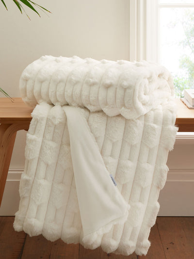 Next Bianca Cream Soft and Cosy Carved Faux Fur Throw 150x200cm- Buy online at McGrocer