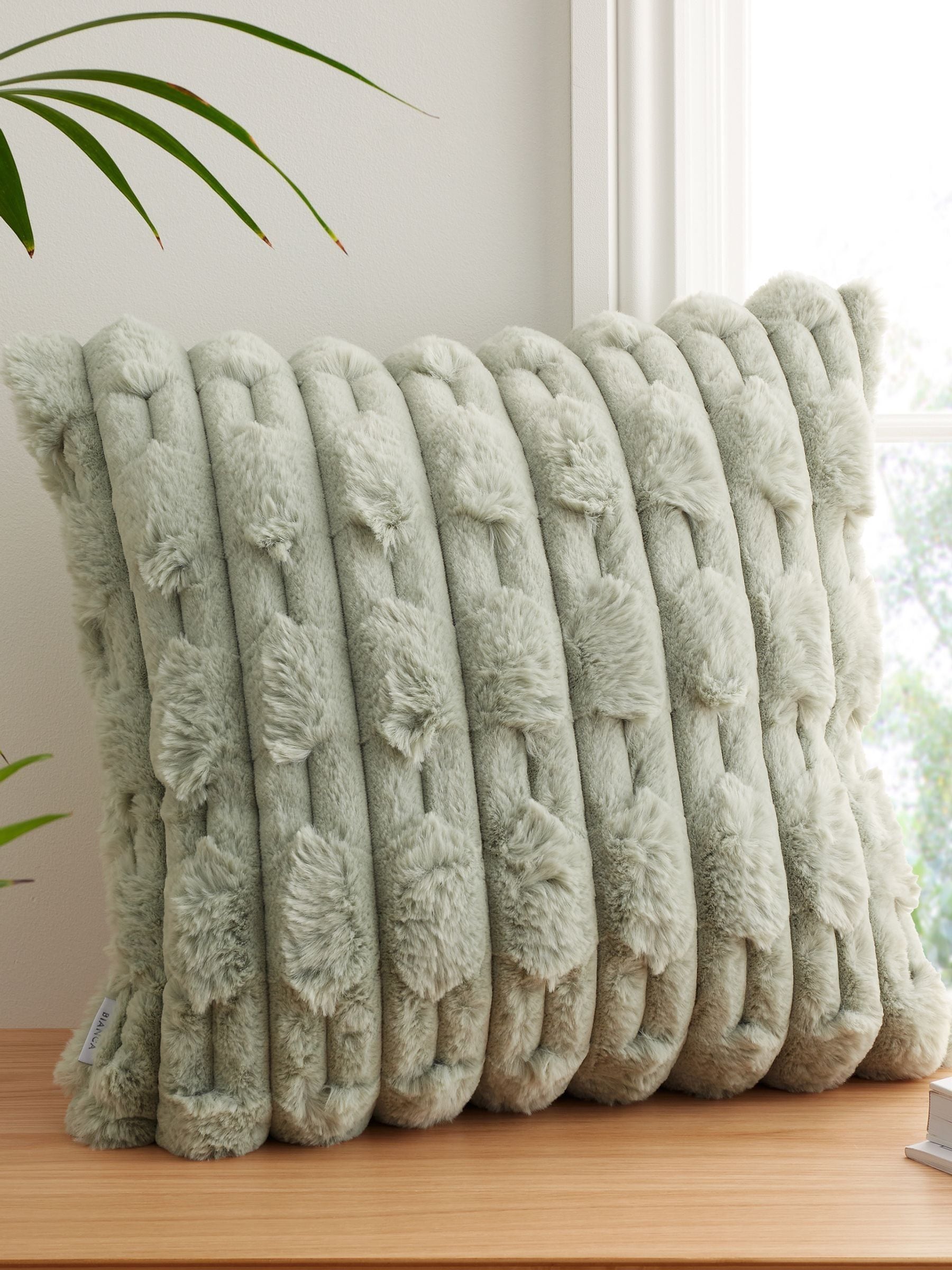 Green carved faux fur cushion 55x55cm - British product