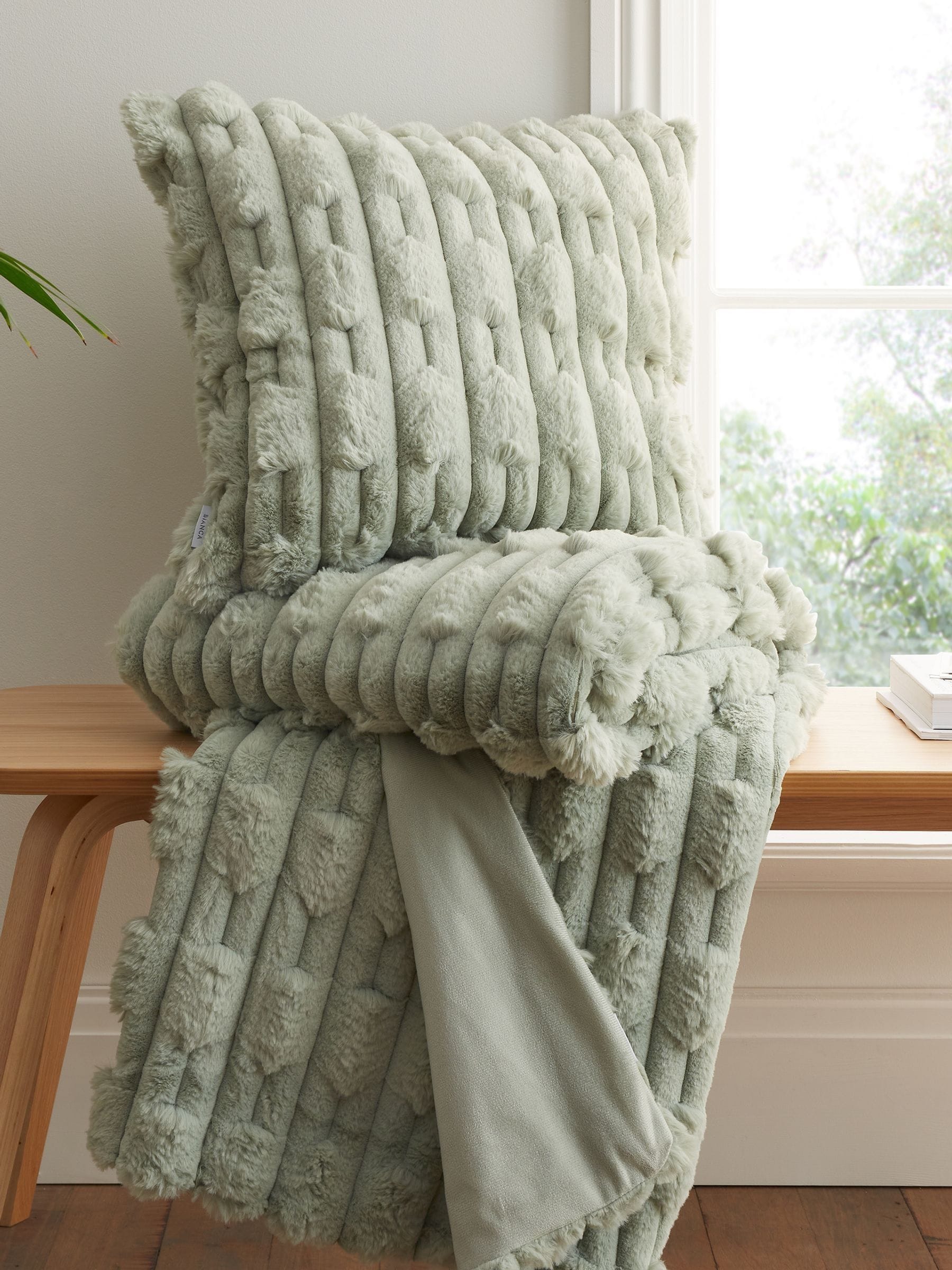 Green carved faux fur cushion 55x55cm - British product
