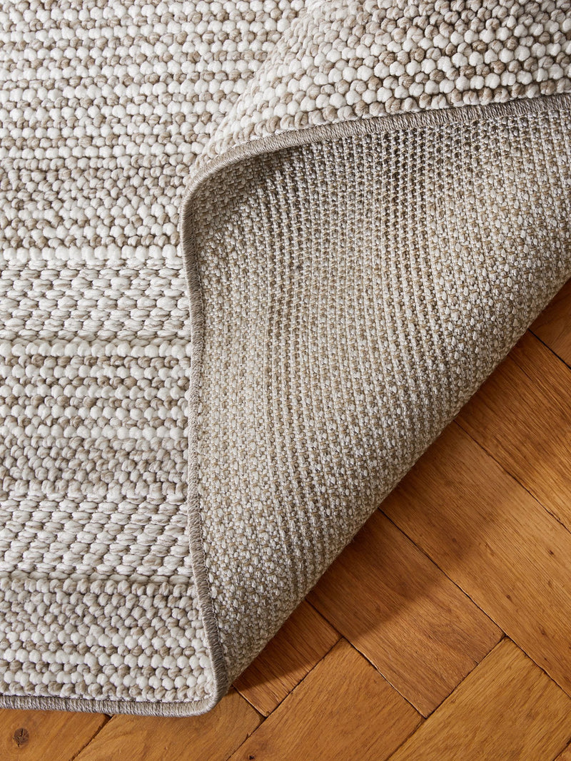 Bobble border rug in natural tones, imported from the UK