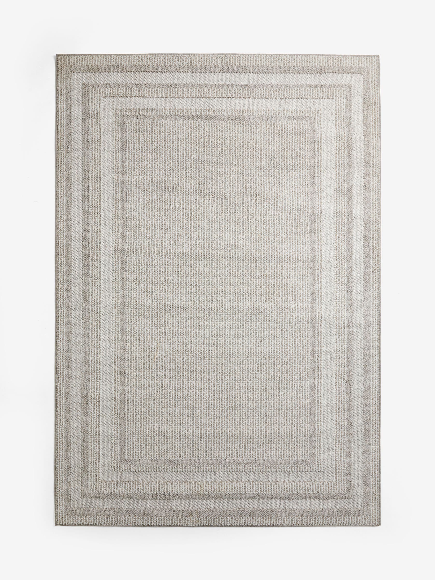 Bobble border rug in natural tones, imported from the UK