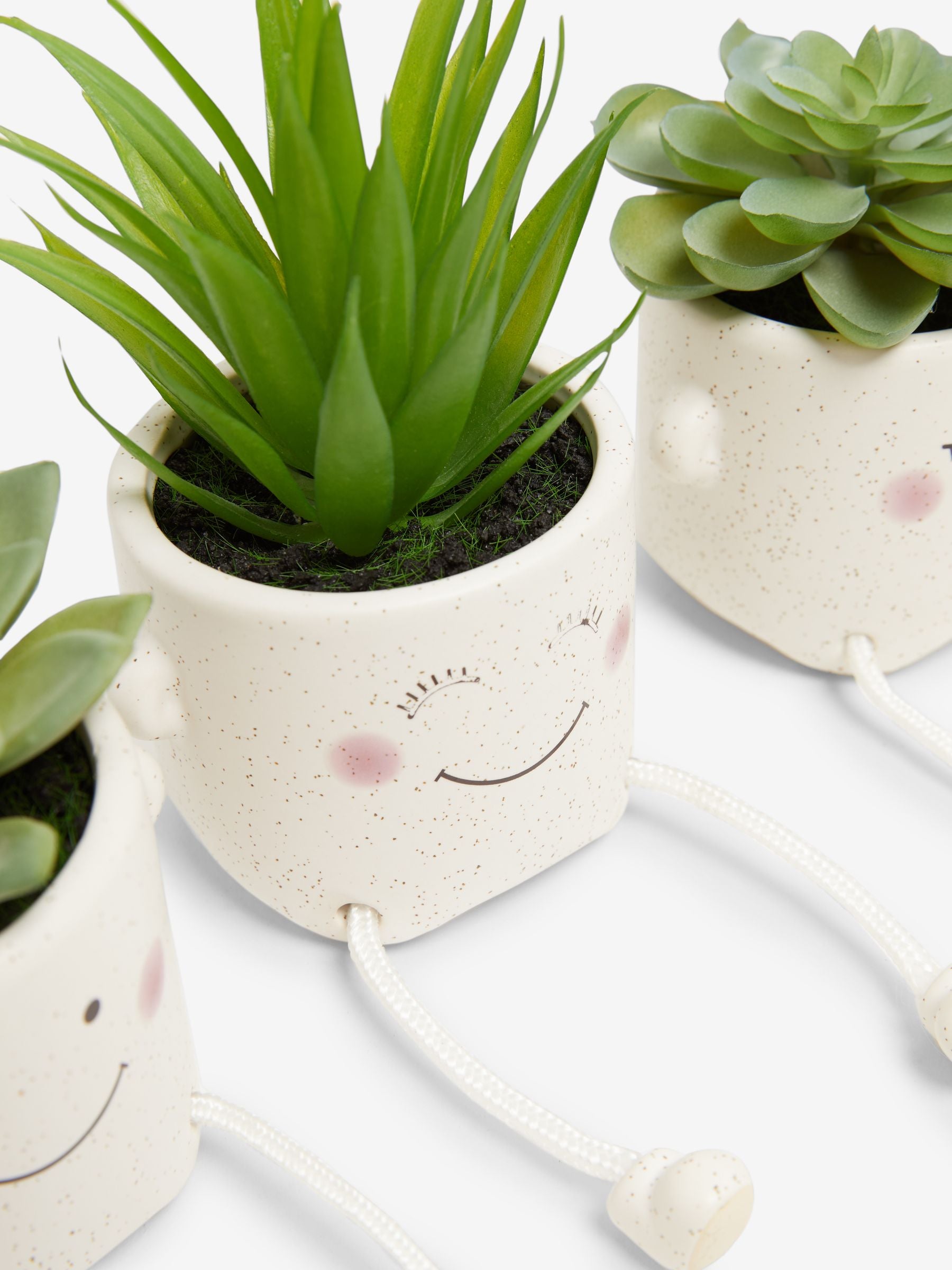 Set of 3 green artificial dangly succulents in character pots (British brand)