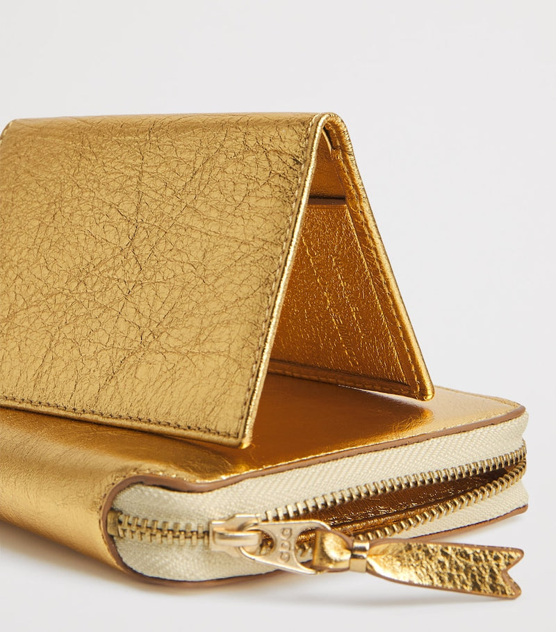 Comme des Garçons vertical card holder with gold metallic accent, imported from the UK