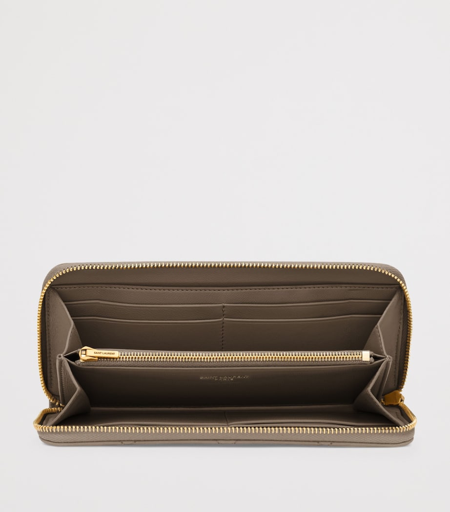 Saint Laurent Matelassé zip-up wallet with YSL monogram (British brand)
