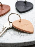 Handmade personalised leather plectrum keyring in four colour options, UK version