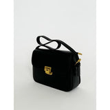 SVNX black shoulder bag with gold clasp (British brand)