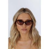 SVNX cat-eye sunglasses tortoiseshell frame thin chain arm, UK version