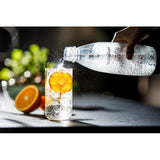 SodaStream carbonating two 1L bottles (British brand)