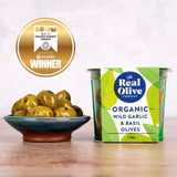 The Real Olive Co. Organic Wild Garlic & Basil Pitted Olives 150g, imported from the UK