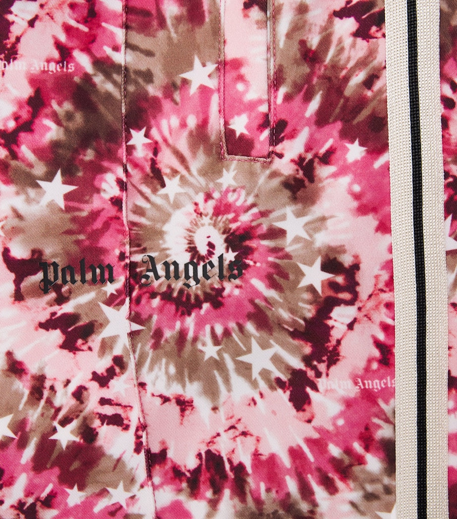 Palm Angels Kids spiral tie-dye trousers for ages 4-12+, imported from the UK