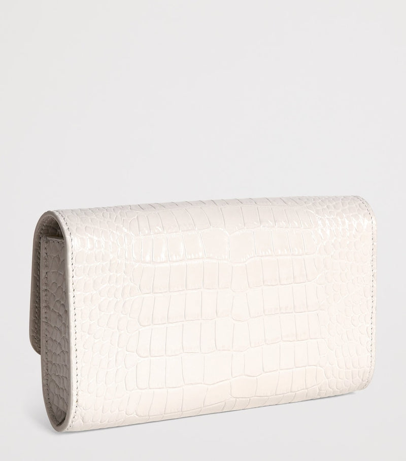 Jeffrey Levinson leather croc-embossed clutch bag, UK version