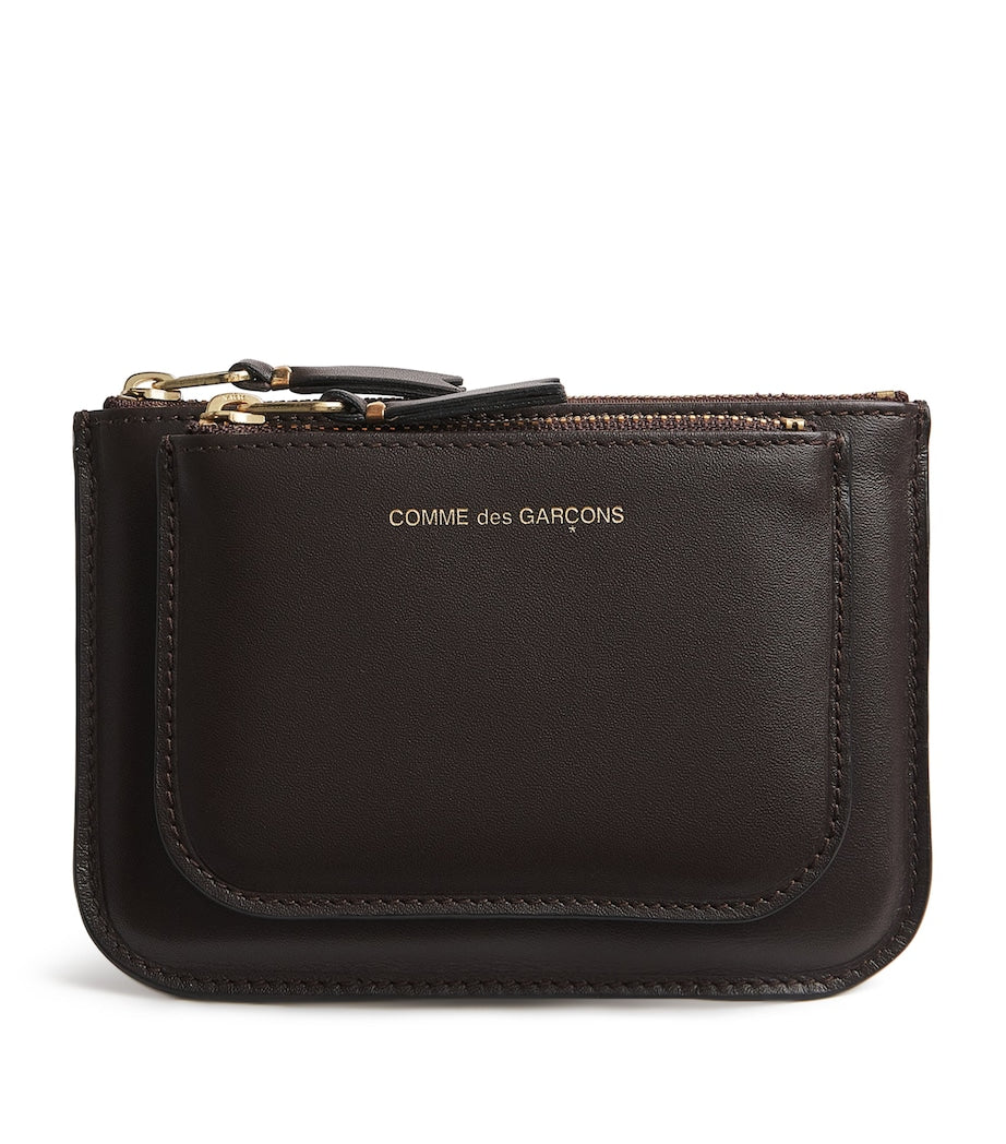 Comme des Garçons medium leather outside pocket wallet, imported from the UK