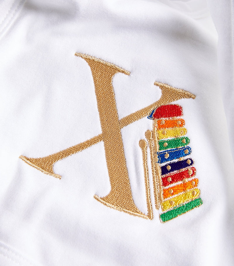 Paint My Dreams cotton X monogram bib, imported from the UK