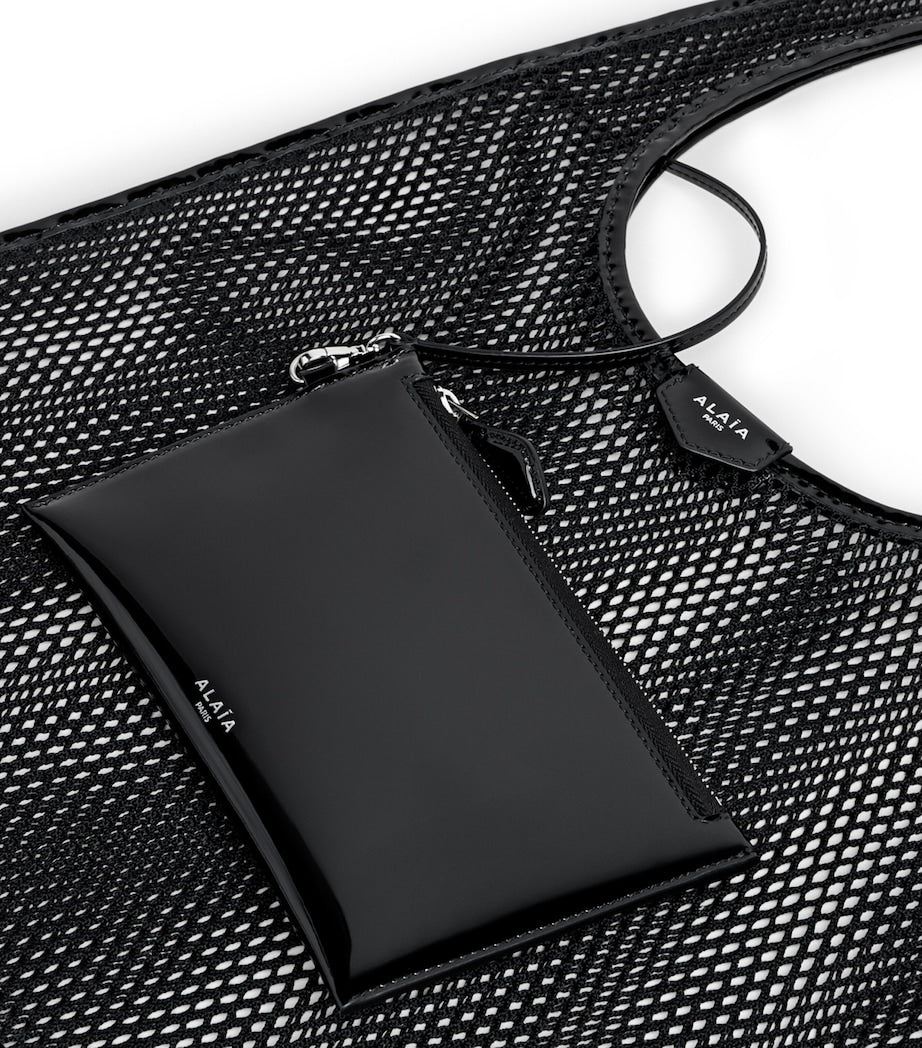 Alaïa leather-trim fishnet shoulder bag, imported from the UK