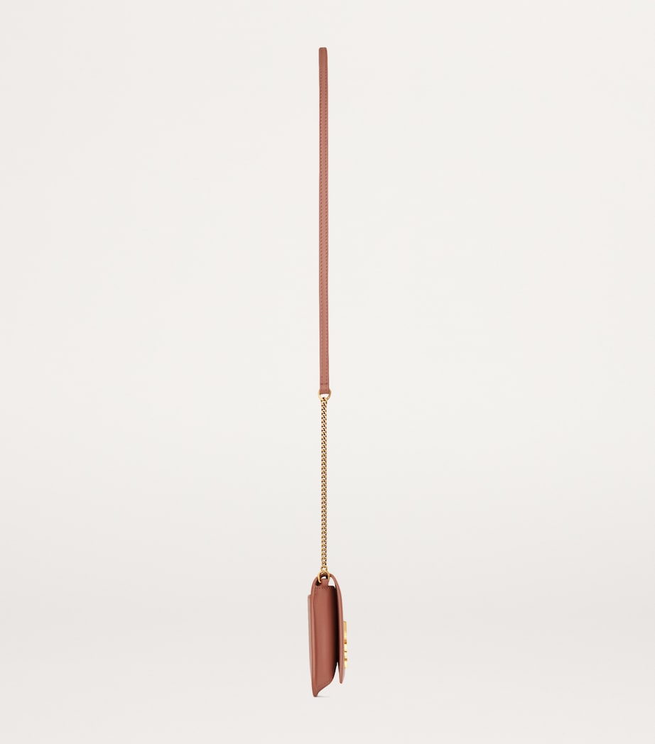 Saint Laurent leather Cassandre phone holder with chain strap, 11x18x2.5cm (British brand)