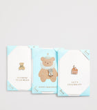 Harrods cake pin badge card with gold-tone lettering (British brand)