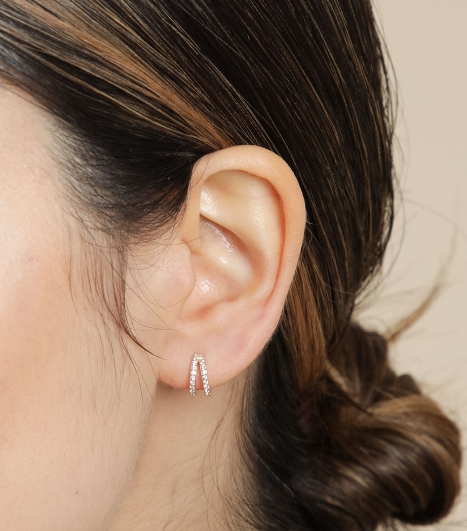 Astrid & Miyu white gold topaz illusion huggie earrings, imported from the UK