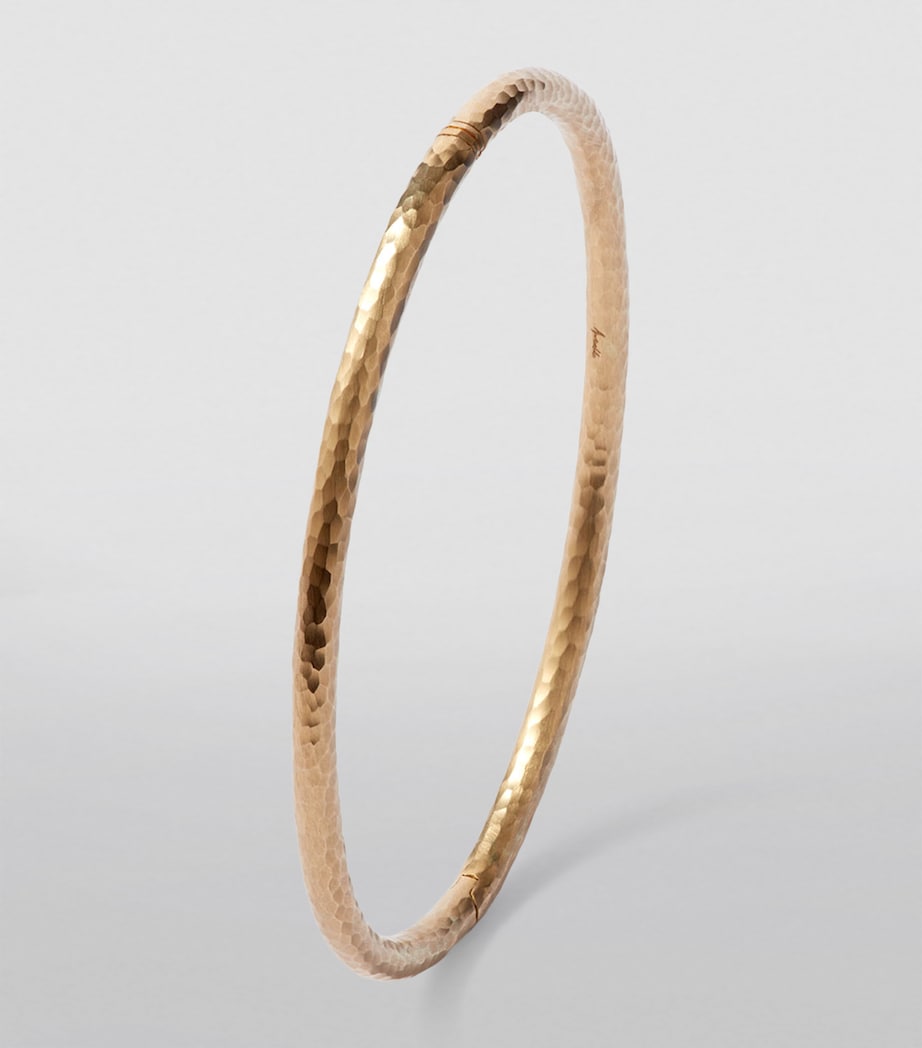 Annoushka yellow gold bangle with hand-hammered finish, imported from the UK