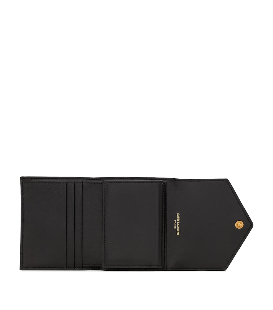Saint Laurent leather quilted trifold wallet with YSL monogram, imported from the UK