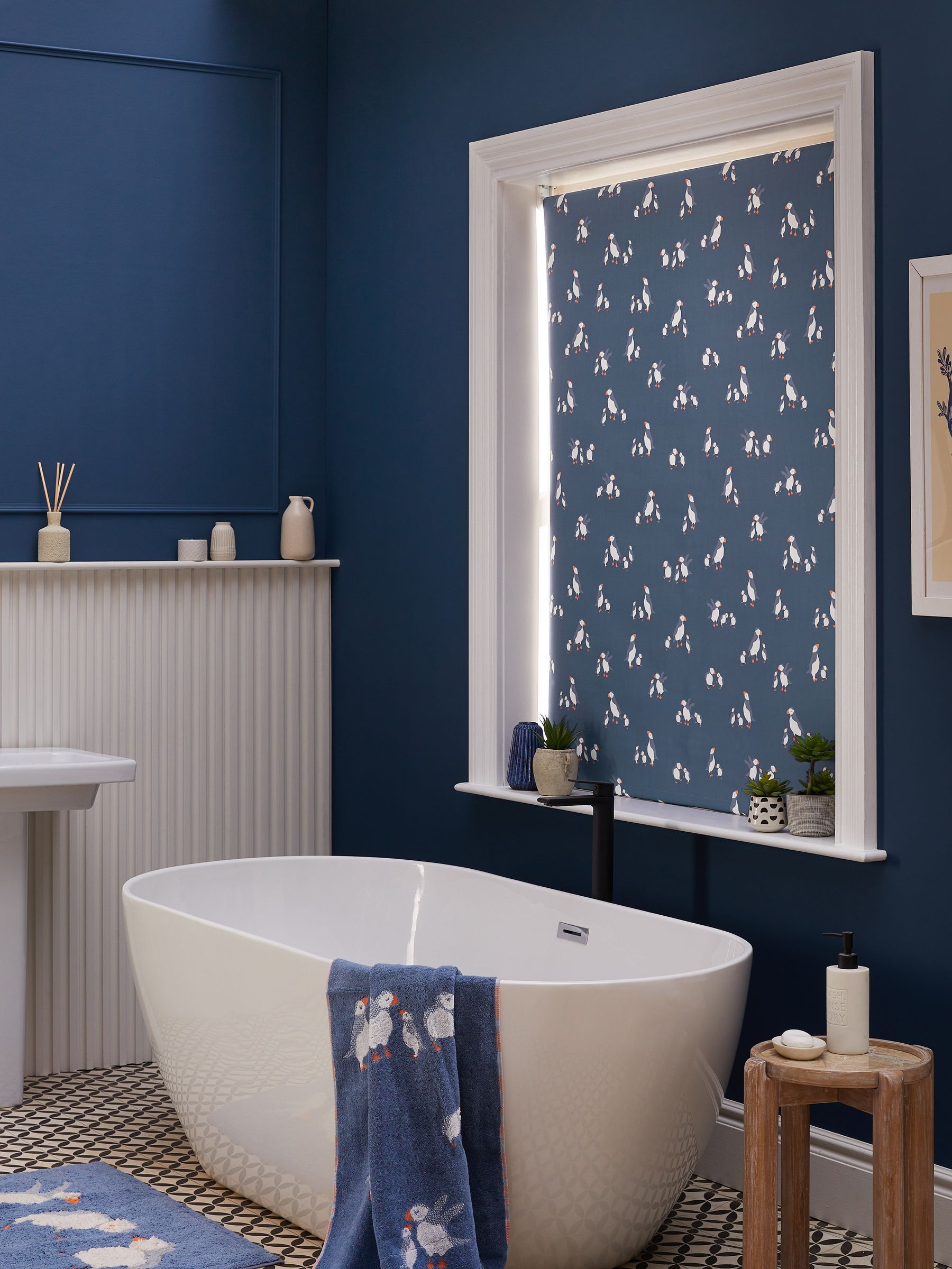 Blue blackout roller blind with puffin print, imported from the UK