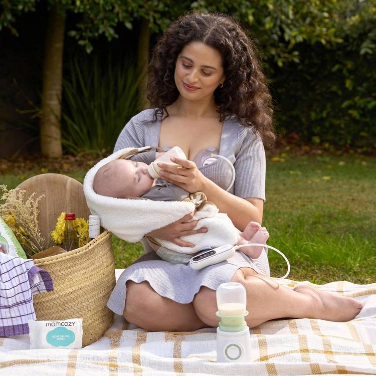 Momcozy portable bottle warmer with smart sensor technology, British product