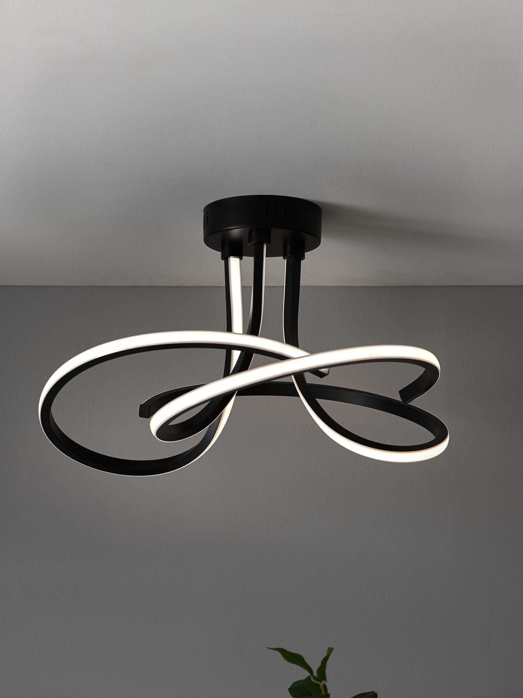 Black sculptural LED flush ceiling light - British product