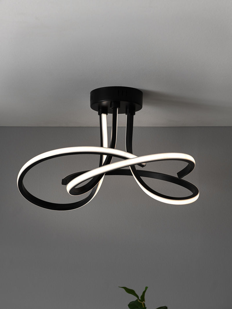 Black sculptural LED flush ceiling light - British product