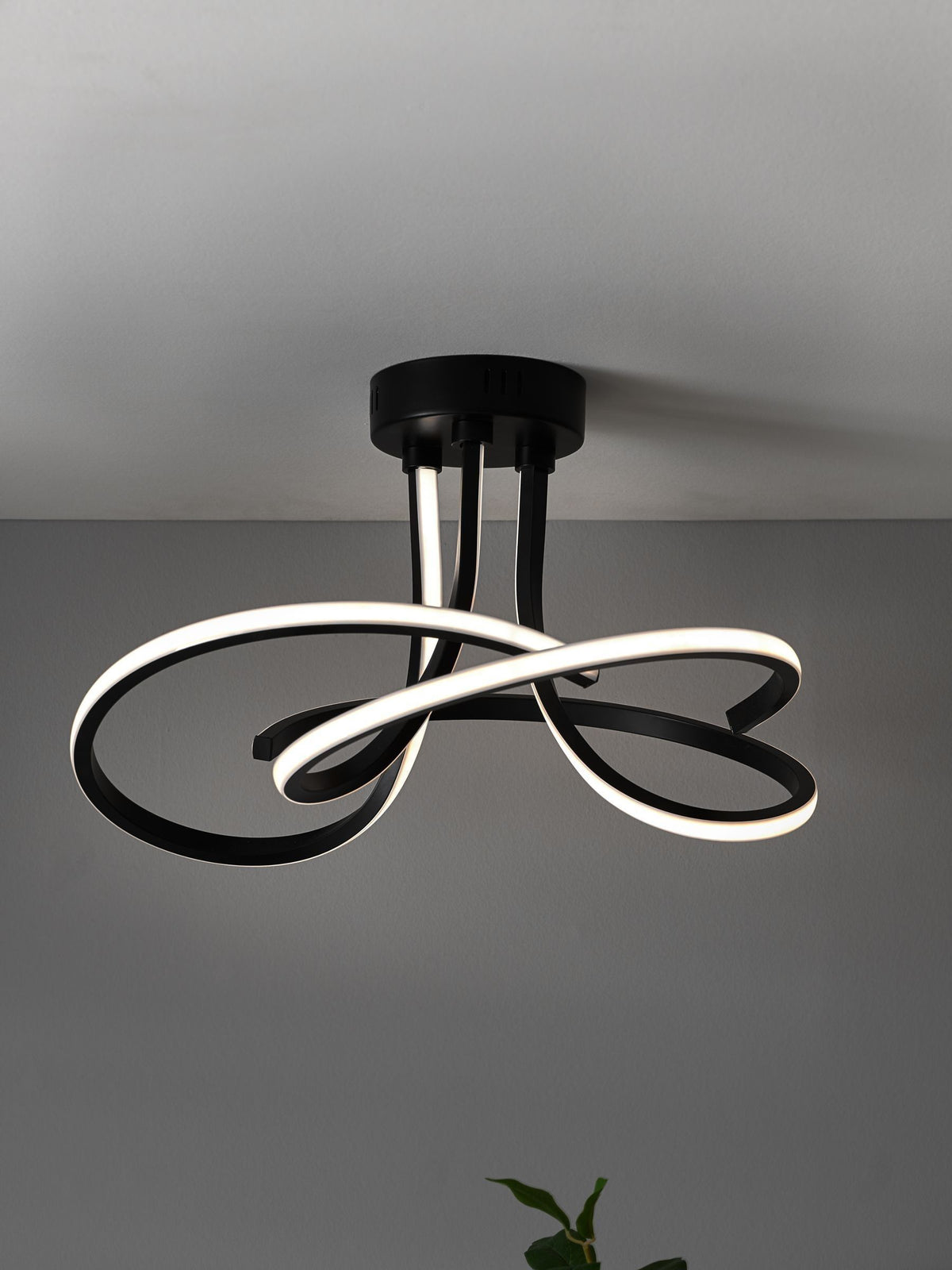 Black sculptural LED flush ceiling light - British product