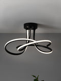 Black sculptural LED flush ceiling light - British product