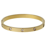 Liars & Lovers gold tone crystal hinged bangle, imported from the UK