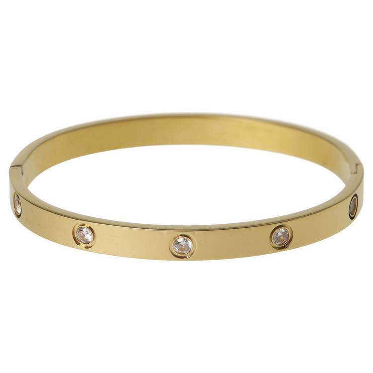 Liars & Lovers gold tone crystal hinged bangle, imported from the UK